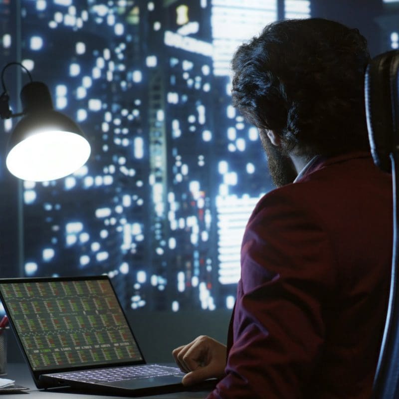 Private equity associate evaluating financial models